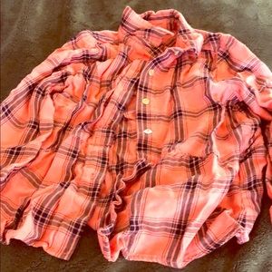 an plaid button down shirt